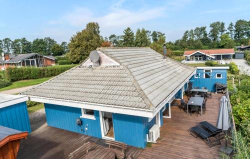 an overhead view of a blue house with a deck at Awesome Home In Hejls With Sauna in Hejls