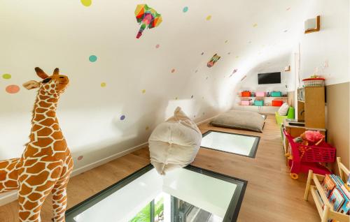 a childs room with a giraffe on the wall at Modern Villa With Private Pool in Saint-Aignan-Grand-Lieu