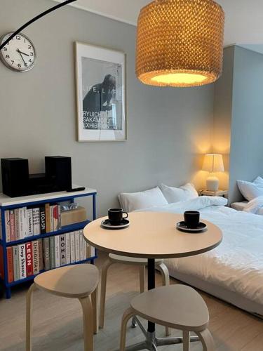 Ένα ή περισσότερα κρεβάτια σε δωμάτιο στο Incheon Berry the Hill Stay 인천송도