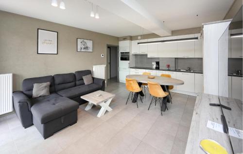 a living room with a couch and a table at Residentie Crystal Ref 99 in Ostend