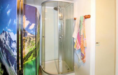 a shower with a glass door in a bathroom at Stunning Stacaravan In Beauchastel in Beauchastel