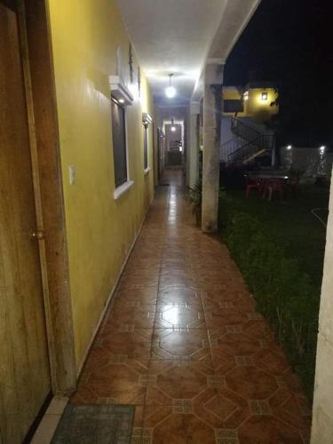 an empty hallway of a building at night at Hotel la paloma in Izamal