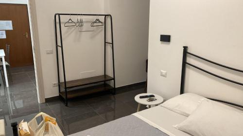a bedroom with a bed and a shower in it at B&B Ladislaus in Ladispoli