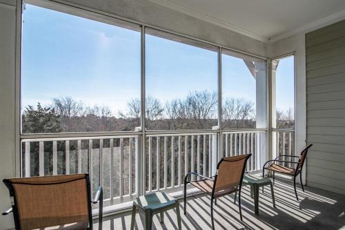 three chairs sitting on a screened in porch with windows at Sun and Fun 1 Bedroom Resort View Suite Sleeps 4 in Pawleys Island