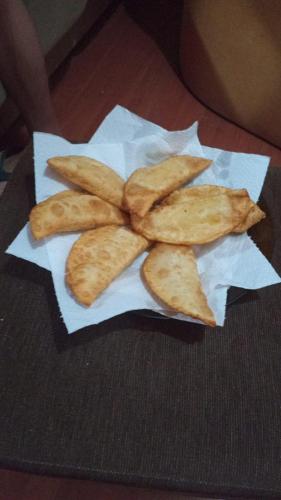 a pile of breadsticks sitting on a piece of paper at Jd Container Graciosa in Quatro Barras