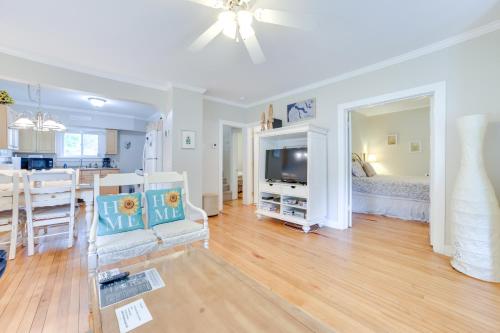 a living room with a kitchen and a dining room at Walk to Lake Michigan Pet-Friendly Charlevoix Gem in Charlevoix