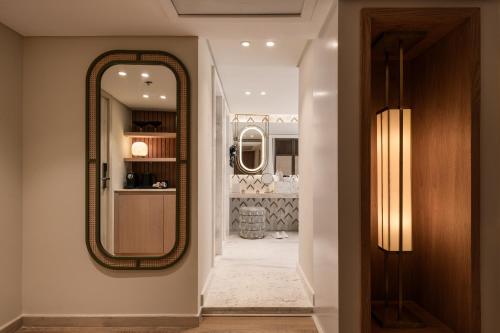 a hallway with a mirror on the wall at Soleil Nile Cruise - Every Monday from Luxor for 4 & 7 Nights, and every Friday from Aswan for 3 & 7 Nights in Luxor