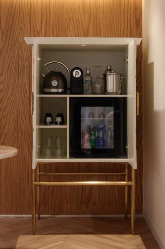 a shelf with a microwave in a kitchen at Soleil Nile Cruise - Every Monday from Luxor for 4 & 7 Nights, and every Friday from Aswan for 3 & 7 Nights in Luxor
