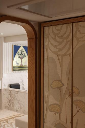 a glass door with a reflection of a room at Soleil Nile Cruise - Every Monday from Luxor for 4 & 7 Nights, and every Friday from Aswan for 3 & 7 Nights in Luxor