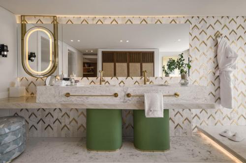 a bathroom with a sink and a large mirror at Soleil Nile Cruise - Every Monday from Luxor for 4 & 7 Nights, and every Friday from Aswan for 3 & 7 Nights in Luxor