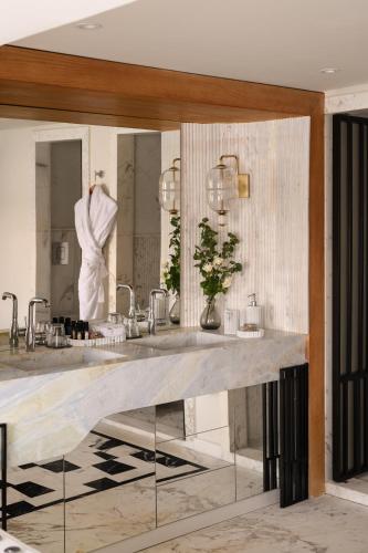 a bathroom with two sinks and a mirror at Soleil Nile Cruise - Every Monday from Luxor for 4 & 7 Nights, and every Friday from Aswan for 3 & 7 Nights in Luxor