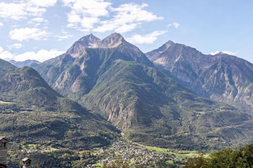 a mountain range with a town in front of it at Alloggio Chez Favre in Blevy