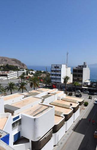 an aerial view of a building with the ocean in the background at Appartement Biela in Al Hoceïma