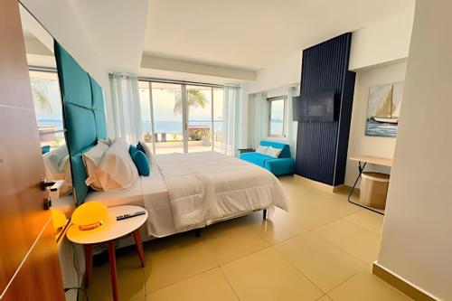 a bedroom with a bed and a view of the ocean at Apartment in the Causeway Amador in Panama City