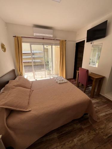 Una cama o camas en una habitación de Complejo Roccatini