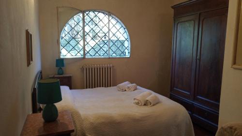 Ένα ή περισσότερα κρεβάτια σε δωμάτιο στο La Cascianella