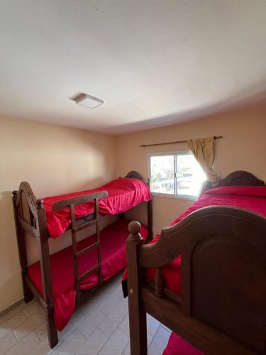 Una cama o camas en una habitación de Complejo Roccatini