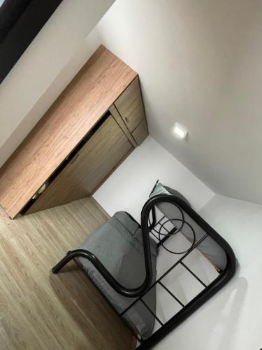 a black bed in a room with a window at Departamento Medellín bello in Bello