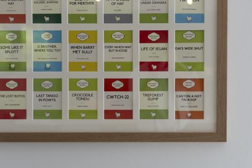 a framed picture of the different apple logos at The Old School House - A Superb Newly Converted Barn with Hot Tub Sleeping 8 guests in Carmarthen