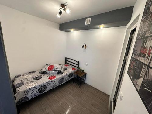 a bedroom with a bed in a room at Casa Bucovineană in Iaşi