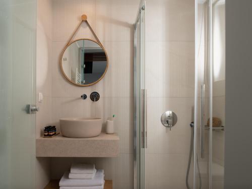 a bathroom with a sink and a mirror at Villa Kalliston in Rethymno Town