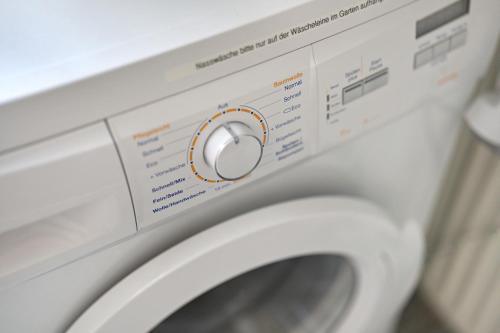 a close up of a washing machine at Haus Rebberg in Wolfach