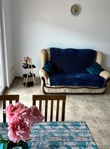 a living room with a couch and a table at Boka Dream view Apartments in Prčanj