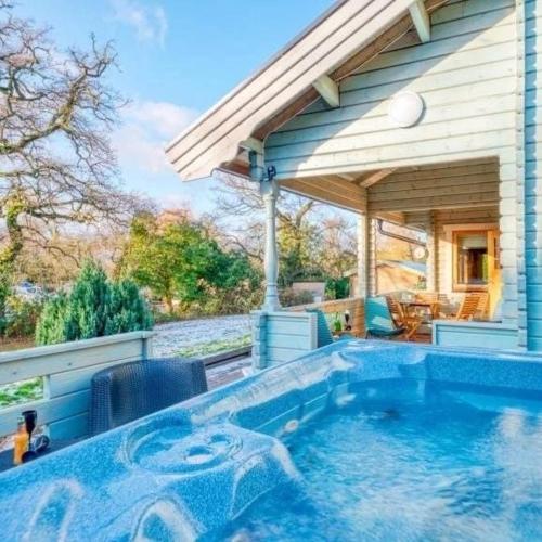 a swimming pool in front of a house at Freedom Lodge Great Ayton Yorkshire in Great Ayton