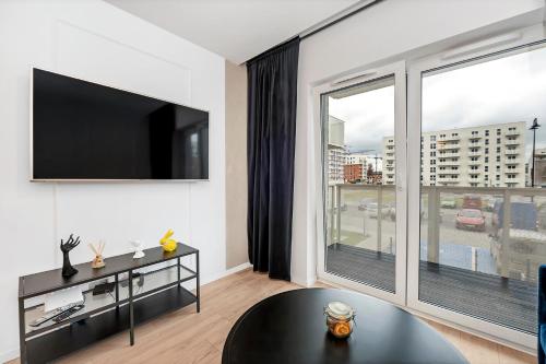 Μια τηλεόραση ή/και κέντρο ψυχαγωγίας στο Lumina comfy apartment Lodz