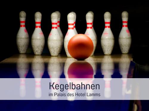 a bowling ball in the middle of a group of pins at Hotel Lamm in Heimbuchenthal