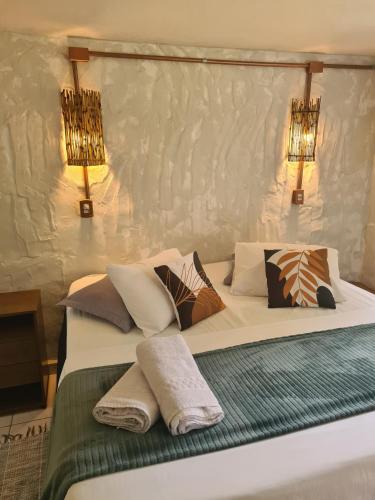 Katil atau katil-katil dalam bilik di Ecofazenda Lodge