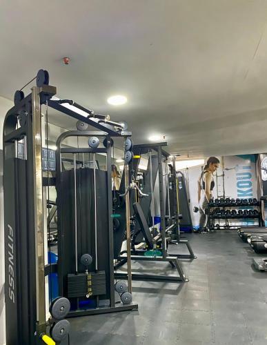 a gym with people working out in the gym at Hotel Zentiva Pinamar in Pinamar