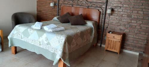 En eller flere senge i et værelse på Alma Dulce