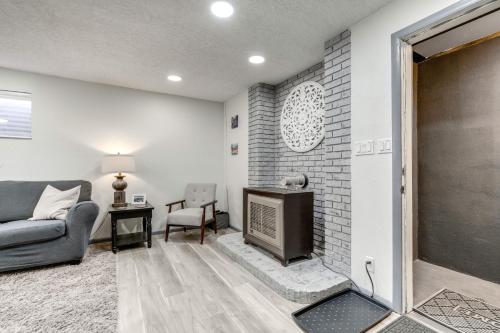 a living room with a couch and a fireplace at Central Cedar City Apartment Walk to SUU! in Cedar City