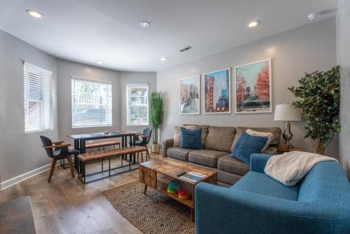 a living room with a couch and a table at Stylish & Bright Gem Overlooks Lovely Park with Great Amenities in Chicago