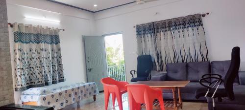 Zona de estar de Nature stay Mysore