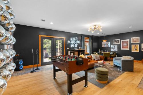 a living room with a pool table in the middle of it at Luxury Chalet, Firepit, Sauna, Pet Friendly, 5 mins to Windham Mtn resort in Windham