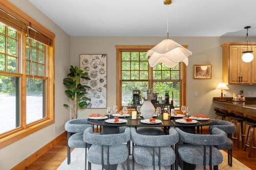 a dining room with a table and chairs at Luxury Chalet, Firepit, Sauna, Pet Friendly, 5 mins to Windham Mtn resort in Windham