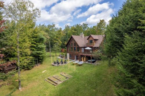 an aerial view of a house with a playground at Luxury Chalet, Firepit, Sauna, Pet Friendly, 5 mins to Windham Mtn resort in Windham