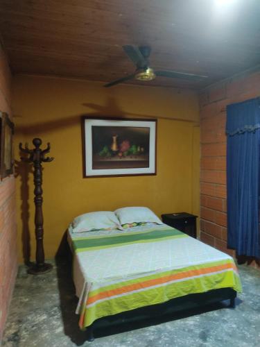 Postel nebo postele na pokoji v ubytování Hostal VILLA JULIANA