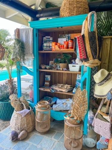 a store with baskets and hats in a room at Puur Bonaire Boetiekhotel in Belnem