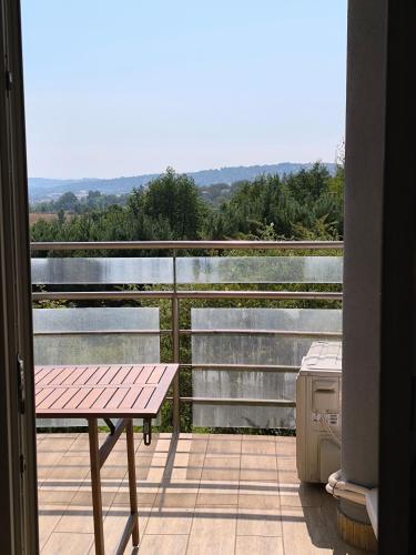 a balcony with a picnic table and a grill at Zielone wzgórze in Przemyśl