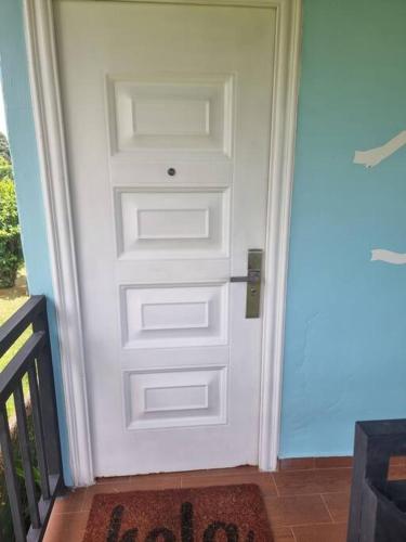 a white door with a small window on it at Cool Loft with King Bed 10 mins David 20 mins to Boquete in Dolega