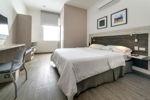 Ένα ή περισσότερα κρεβάτια σε δωμάτιο στο Hotel Park 85