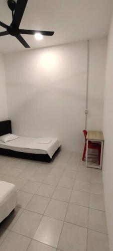 Katil atau katil-katil dalam bilik di Homestay Bandar Puteri Jaya