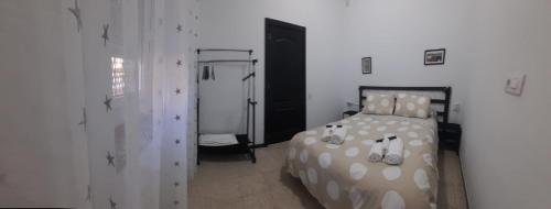 Ένα ή περισσότερα κρεβάτια σε δωμάτιο στο Almaden 7A