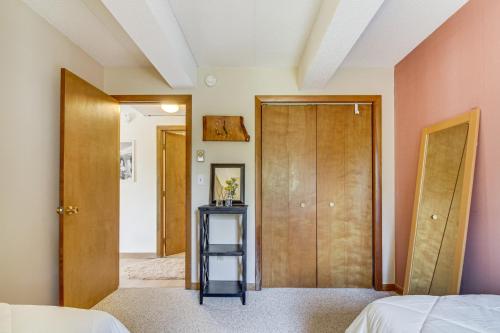 a room with a bed and a closet and a door at Bearfoot Apres Mtn-View Condo Less Than 1 Mi to Mt Snow! in Podunk