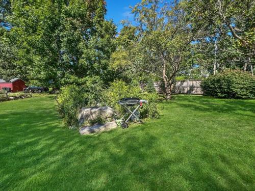 a grill in the grass in a yard at Long Sands Your All-Season GetAway Brought to you by GetAway Vacations in York