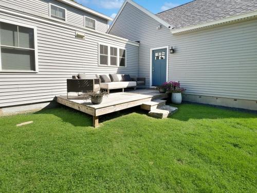 a backyard with a bench and a house at Long Sands Your All-Season GetAway Brought to you by GetAway Vacations in York