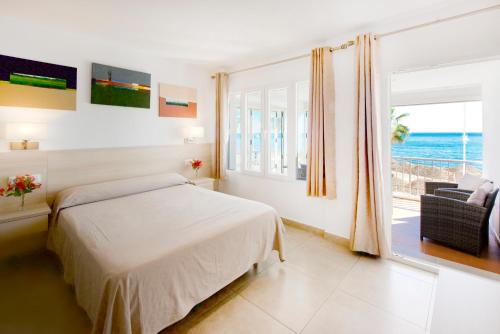 Postel nebo postele na pokoji v ubytování Hotel San Miguel